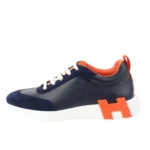 کفش زنانه هرمس بونسینگ Hermès Bouncing Sneaker با رنگ سرمه‌ای نارنجی و طراحی لوکس چرم طبیعی